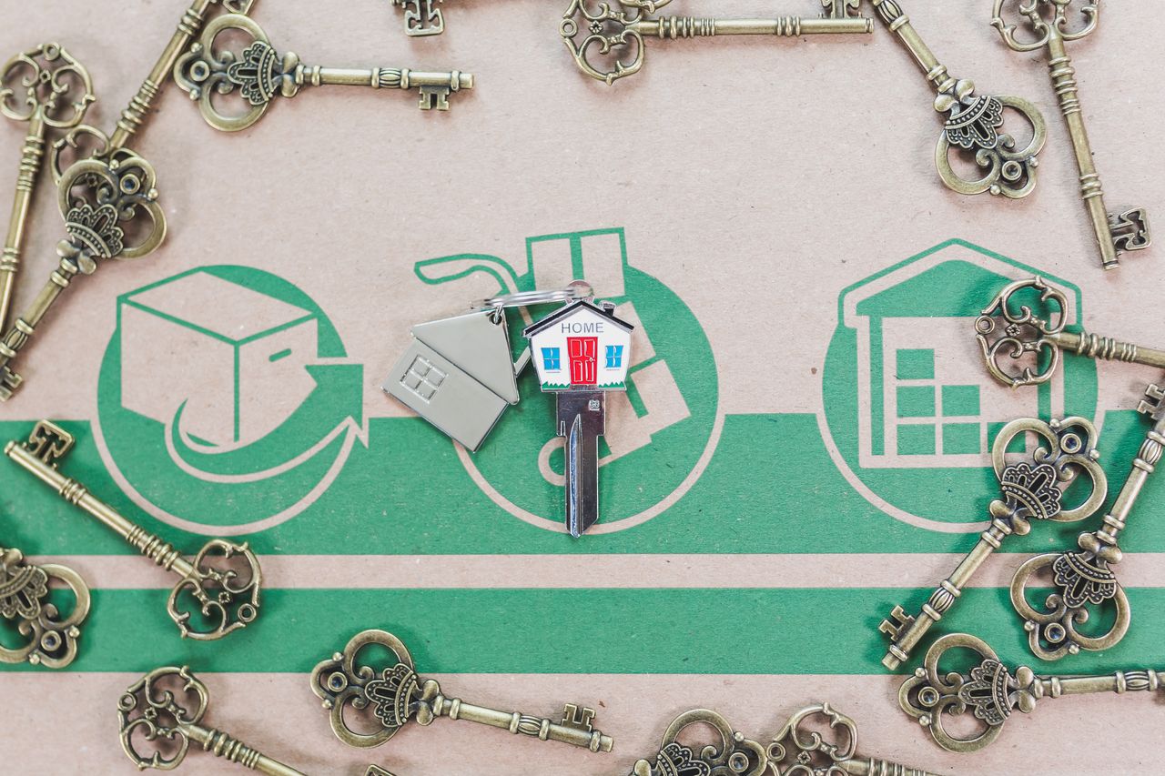 hero-img-02 A collection of vintage keys with a modern house key symbolizing real estate investment.